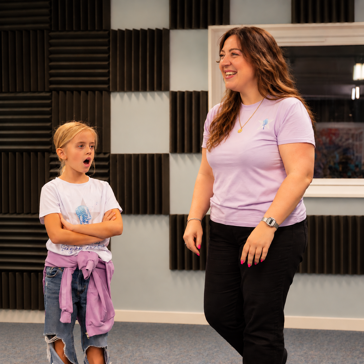 Ella leading a Rising Stars session alongside a young singer