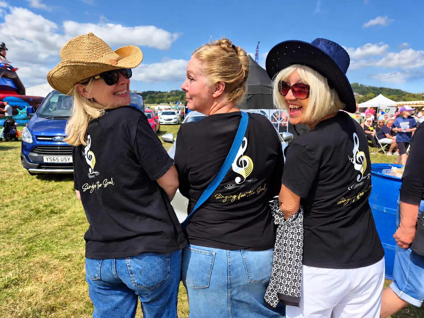 Three Singing for the Soul friends together at a festival