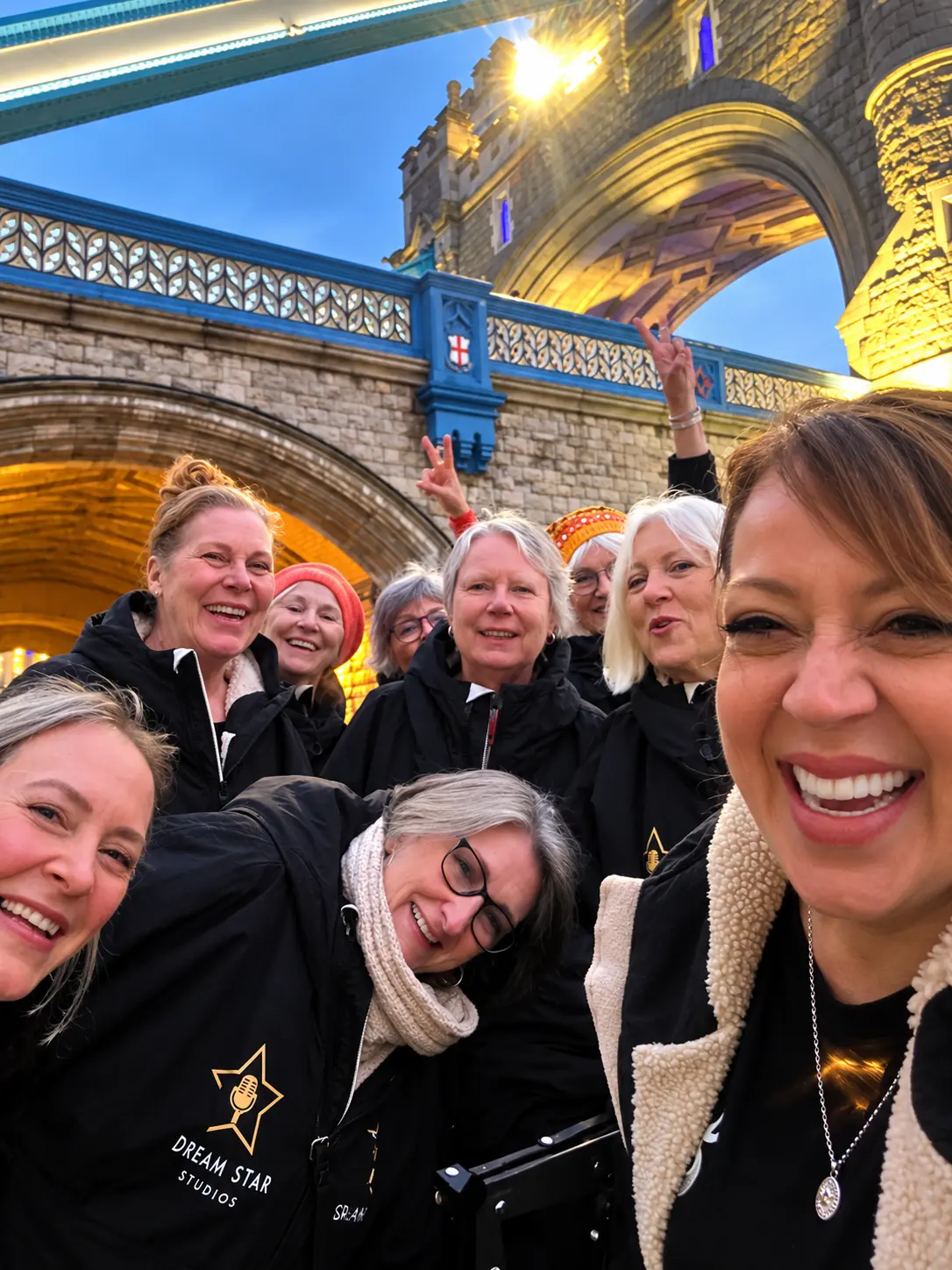 Choir friends taking a selfie by Tower Bridge